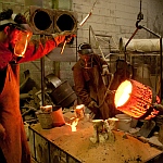 Pouring the molten bronze into ceramic shells