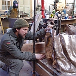 Zach is putting the sections of the bronze together
