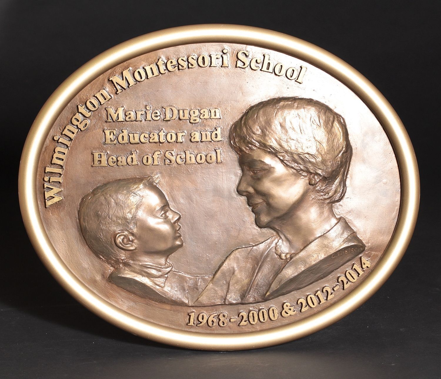 Relief plaque honoring school founder